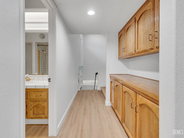 laundry room featuring light hardwood / wood-style flooring