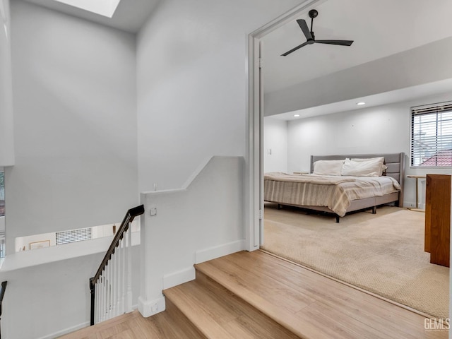 bedroom featuring hardwood / wood-style floors and ceiling fan