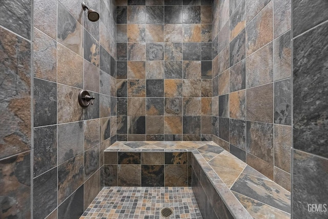 bathroom featuring tiled shower