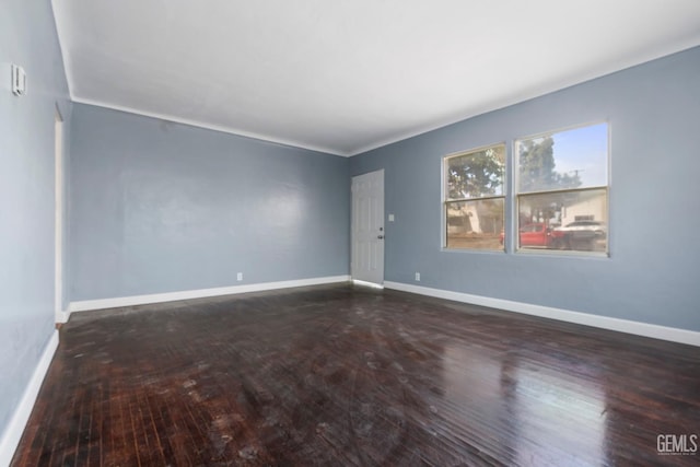 unfurnished room with dark hardwood / wood-style floors