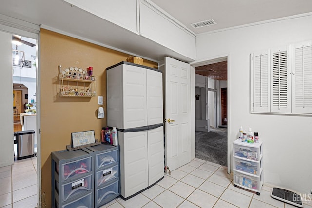 laundry area with light tile patterned flooring