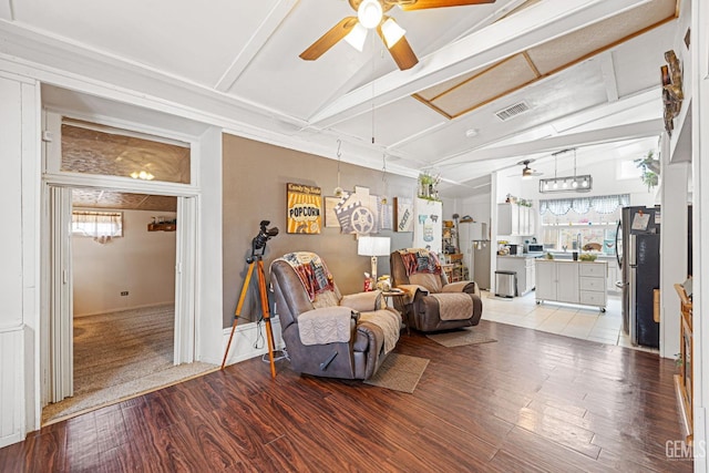 living room with lofted ceiling with beams, ceiling fan, and light hardwood / wood-style flooring