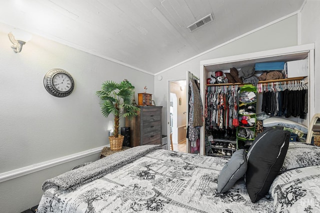 bedroom with crown molding, a closet, wood ceiling, and vaulted ceiling