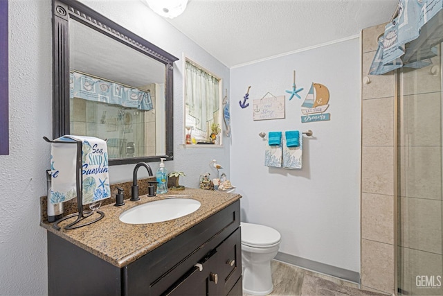 bathroom featuring walk in shower, vanity, a textured ceiling, hardwood / wood-style flooring, and toilet