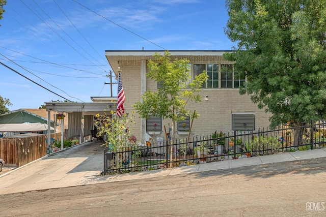 view of front of property featuring a carport