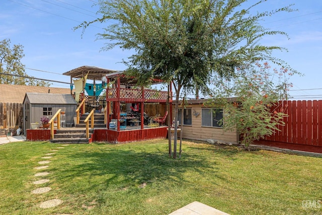 back of house featuring a shed and a yard