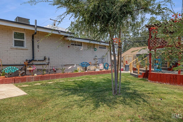 view of yard with central AC unit