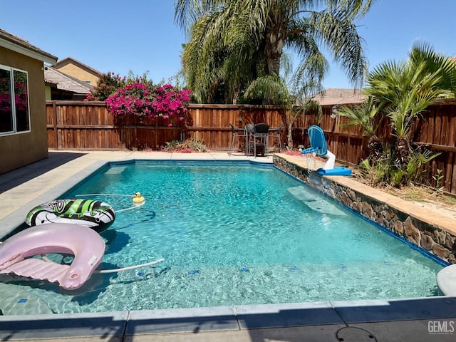 9902 Metropolitan Way, Bakersfield, CA 93311 - view of pool with a fenced backyard, a grill, and a patio area