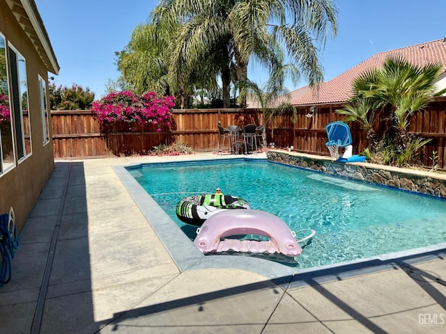 9902 Metropolitan Way, Bakersfield, CA 93311 - view of swimming pool featuring a fenced backyard and a patio