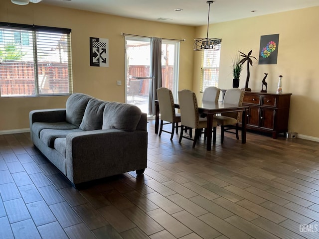 9902 Metropolitan Way, Bakersfield, CA 93311 - living area with a chandelier and dark wood-style flooring