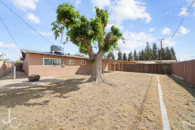 3713 Sechrest Ave, Bakersfield, CA 93309 - fenced backyard with a fire pit and a patio area