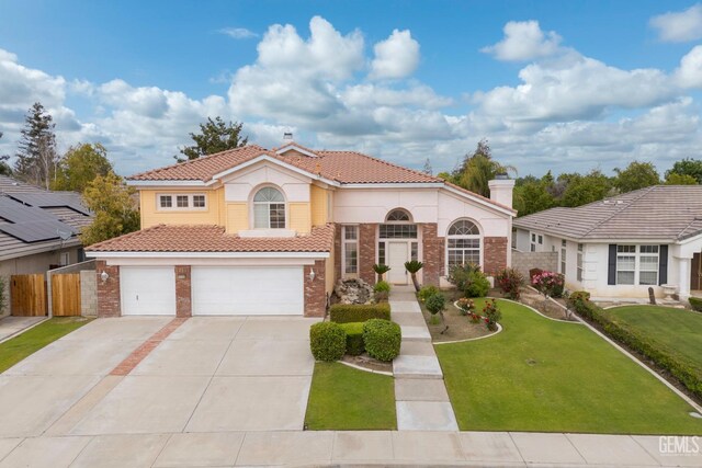 view of front of home with brick siding, a tile roof, concrete driveway, and an attached garage