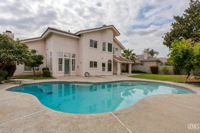 view of swimming pool featuring a fenced in pool, a fenced backyard, and a patio area