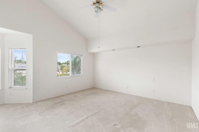 spare room featuring a wealth of natural light, ceiling fan, and carpet flooring
