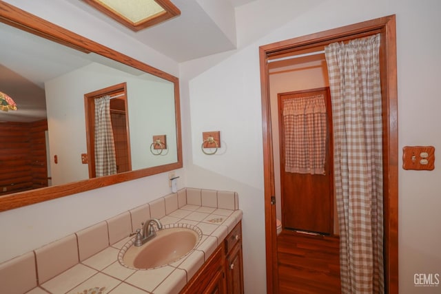 bathroom featuring hardwood / wood-style floors and vanity