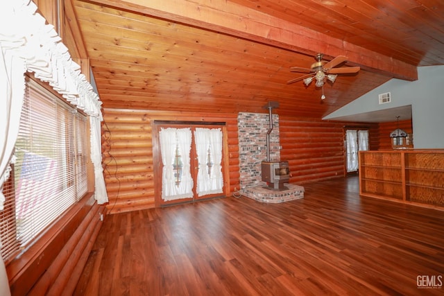 unfurnished living room with a wood stove, log walls, wooden ceiling, and hardwood / wood-style flooring