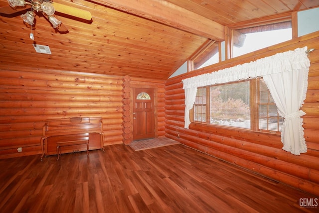 interior space featuring rustic walls, a healthy amount of sunlight, wood-type flooring, wooden ceiling, and vaulted ceiling with beams