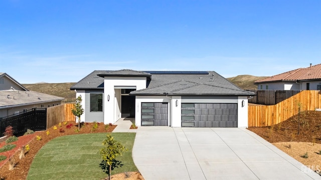 12914 Altair Ct, Bakersfield, CA 93314 - prairie-style house with a mountain view, a garage, fence, and concrete driveway