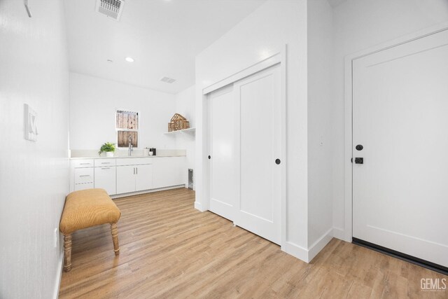 12914 Altair Ct, Bakersfield, CA 93314 - interior space featuring light wood-style flooring, baseboards, a sink, and visible vents