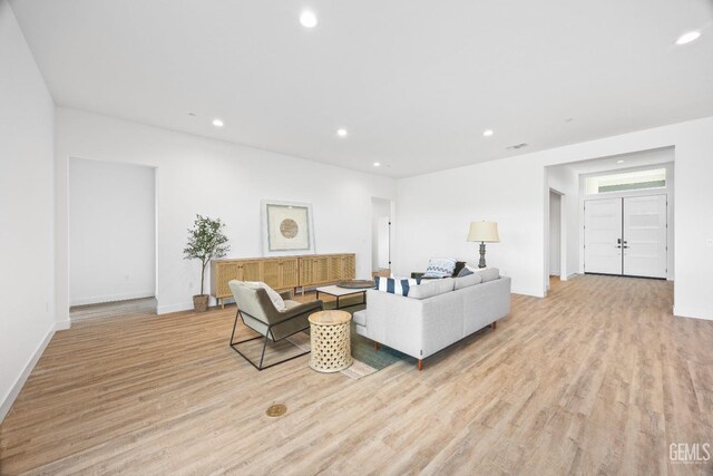 12914 Altair Ct, Bakersfield, CA 93314 - living room featuring light wood-style floors, baseboards, visible vents, and recessed lighting