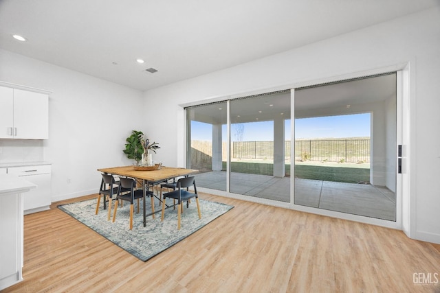 12914 Altair Ct, Bakersfield, CA 93314 - dining space featuring light wood-style floors, baseboards, and a healthy amount of sunlight