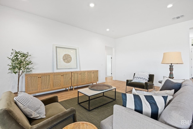 12914 Altair Ct, Bakersfield, CA 93314 - living room with visible vents, recessed lighting, and light wood-style floors