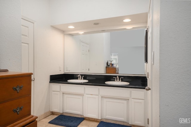 bathroom with tile patterned flooring and vanity