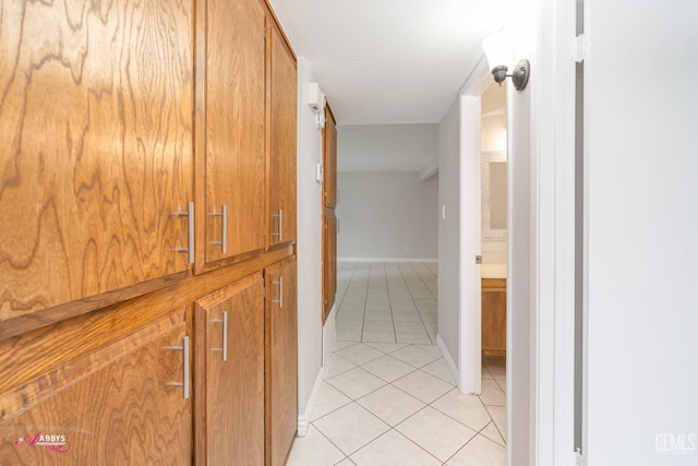 corridor with light tile patterned floors