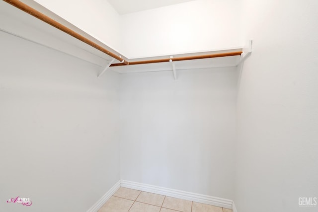 walk in closet featuring light tile patterned floors