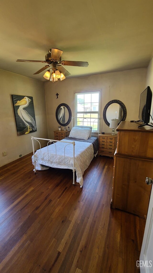 2617 4th St, Bakersfield, CA 93304 - bedroom featuring dark wood-style flooring and a ceiling fan