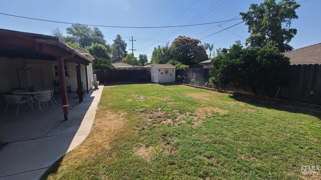 2617 4th St, Bakersfield, CA 93304 - fenced backyard with a storage unit and a patio