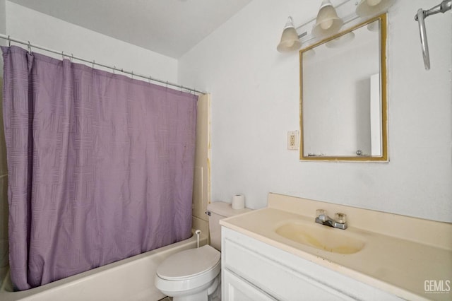 full bathroom featuring shower / tub combo, vanity, and toilet