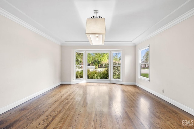 3025 19th St, Bakersfield, CA 93301 - unfurnished room featuring crown molding, baseboards, and wood finished floors
