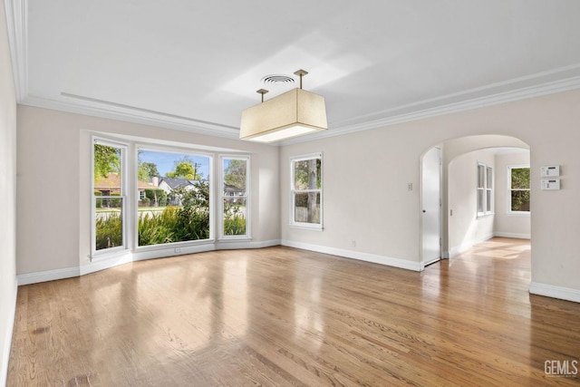 3025 19th St, Bakersfield, CA 93301 - spare room with wood finished floors, baseboards, visible vents, arched walkways, and ornamental molding