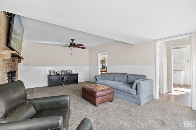 3025 19th St, Bakersfield, CA 93301 - carpeted living area with a brick fireplace and a ceiling fan