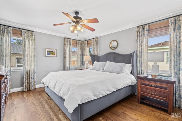 3025 19th St, Bakersfield, CA 93301 - bedroom with baseboards, crown molding, multiple windows, and wood finished floors