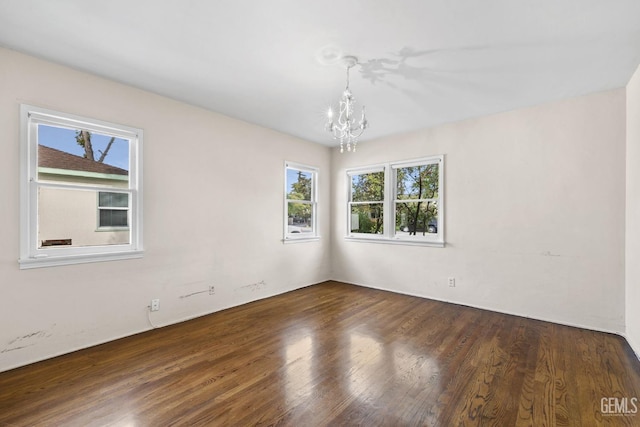 3025 19th St, Bakersfield, CA 93301 - spare room with an inviting chandelier and wood finished floors