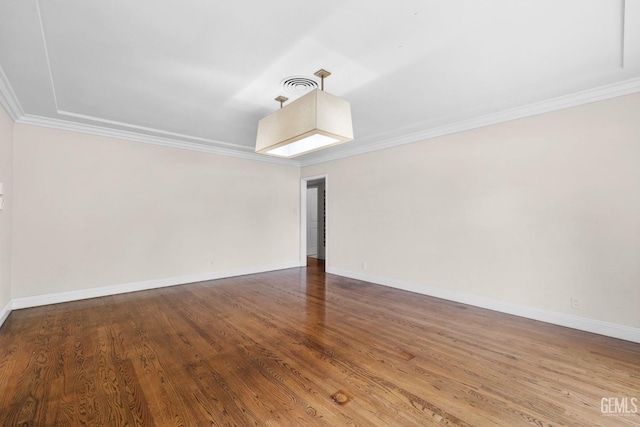 3025 19th St, Bakersfield, CA 93301 - spare room featuring visible vents, crown molding, and wood finished floors