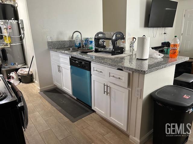 kitchen featuring wood tiled floor, dishwasher, secured water heater, white cabinetry, and a sink