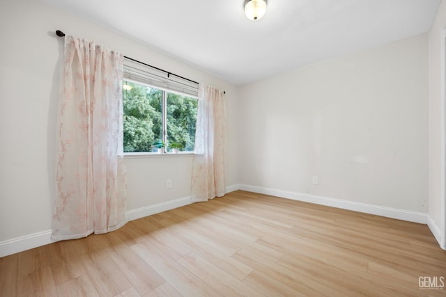 spare room featuring light hardwood / wood-style floors