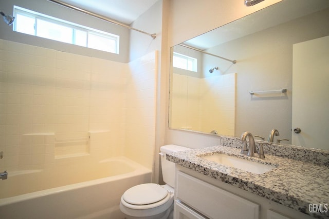 bathroom with toilet, tub / shower combination, and vanity