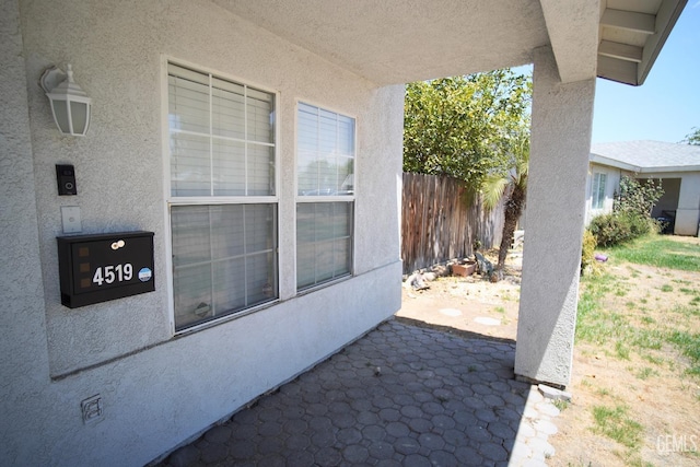 view of patio / terrace featuring fence