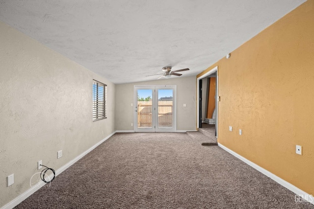 empty room featuring carpet floors and ceiling fan