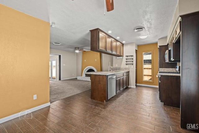 kitchen featuring ceiling fan, dark hardwood / wood-style floors, dishwasher, and dark brown cabinets