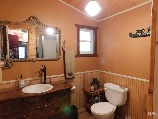 9525 Shirley Meadows Rd Unit 6, Wofford Heights, CA 93285 - bathroom featuring a wainscoted wall, vanity, crown molding, and wood walls