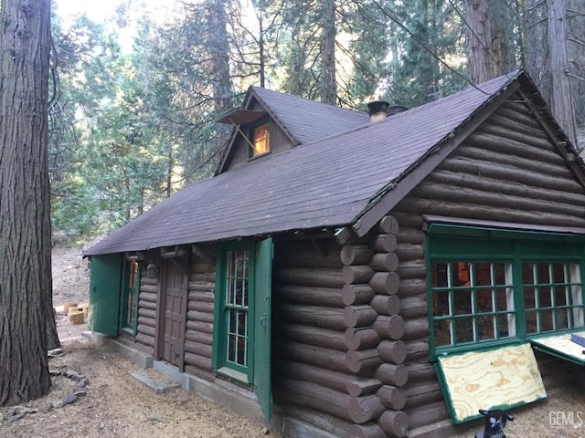 9525 Shirley Meadows Rd Unit 6, Wofford Heights, CA 93285 - view of property exterior featuring log siding, a shingled roof, and an outdoor structure