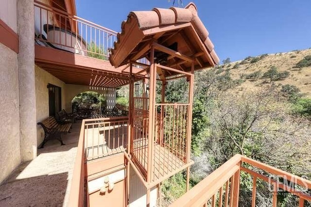 view of patio with a balcony