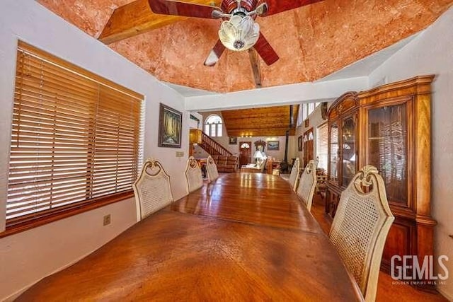 interior space with stairs, wood finished floors, and a ceiling fan