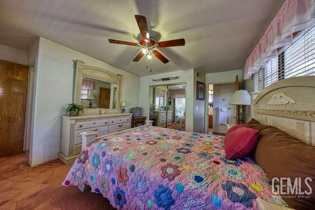 bedroom with light colored carpet and ceiling fan