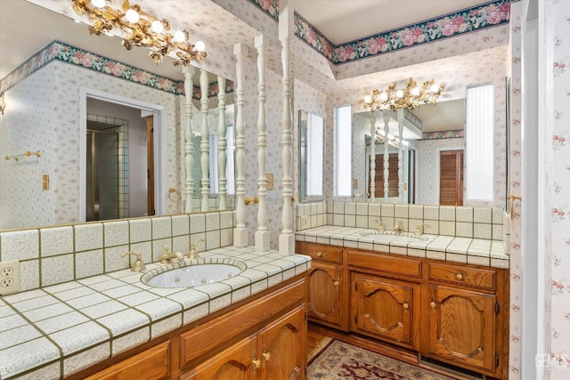 7858 Stine Rd, Bakersfield, CA 93313 - full bath with a sink, an inviting chandelier, a stall shower, and wallpapered walls